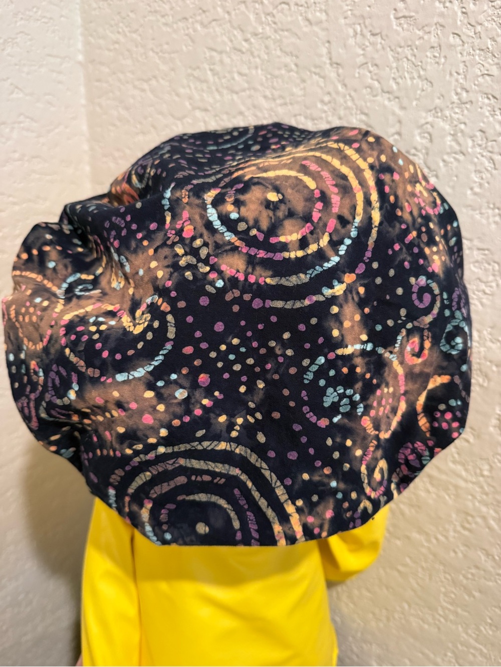 Surgical scrub hat in circular pattern